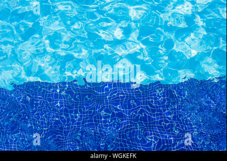 surface of blue swimming pool,background of water in swimming pool. Stock Photo