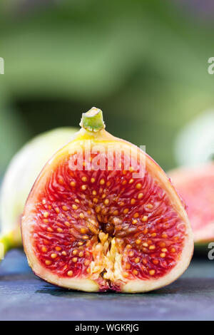 Fresh juicy figs cut in half close up Stock Photo