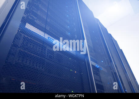 Server Racks In Empty Secure Computer Data Centre. Stock Photo