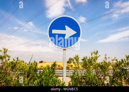 Single direction arrow sign, continue forward with motivation. Stock Photo