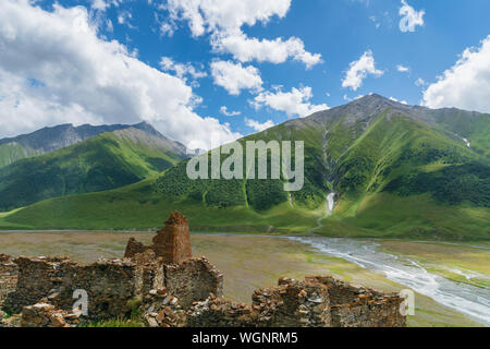 Truso Valley and Gorge  landscape with Zakagori Fortress on trekking / hiking route, in Kazbegi, Georgia. Truso valley is a scenic trekking route Stock Photo