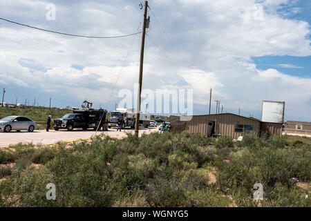 Odessa, Texas, USA. 1st Sep, 2019. Teams from the Federal Bureau of Investigation search a home in a rural residential area in west Odessa, Texas. A gunman fatally shot five people and wounded 21 others the day before on Aug. 31. The death toll rose to seven as of the morning of Sep. 1. Credit: Joel Angel Juarez/ZUMA Wire/Alamy Live News Stock Photo
