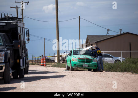 Odessa, Texas, USA. 1st Sep, 2019. Teams from the Federal Bureau of Investigation search a home in a rural residential area in west Odessa, Texas. A gunman fatally shot five people and wounded 21 others the day before on Aug. 31. The death toll rose to seven as of the morning of Sep. 1. Credit: Joel Angel Juarez/ZUMA Wire/Alamy Live News Stock Photo