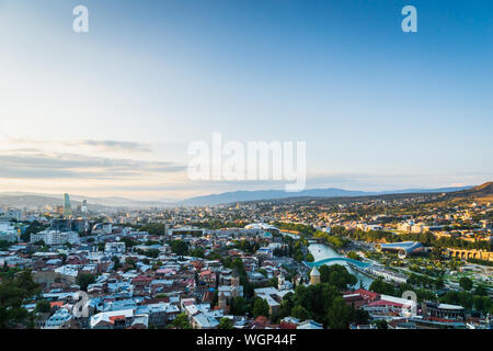 Tbilisi, Georgia - August 2019. Tbilisi downtown and old town aerial from Tbilisi funicular in the capital of Georgia at sunset. Stock Photo