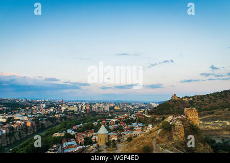 Tbilisi, Georgia - August 2019. Tbilisi downtown and old town aerial from Tbilisi funicular in the capital of Georgia at sunset. Stock Photo