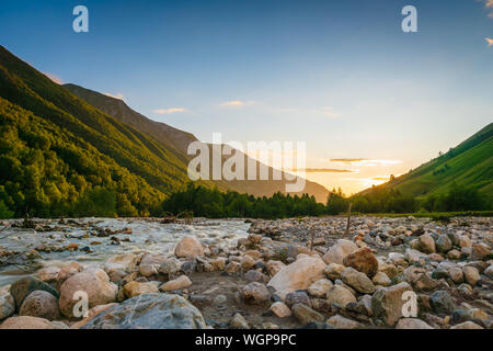 Svaneti landscape at sunset with mountains and river on the trekking and hiking route near Mestia village in Svaneti region, Georgia. Stock Photo