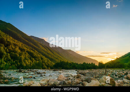 Svaneti landscape at sunset with mountains and river on the trekking and hiking route near Mestia village in Svaneti region, Georgia.
