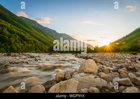 Svaneti landscape at sunset with mountains and river on the trekking and hiking route near Mestia village in Svaneti region, Georgia.