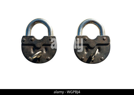 Two closed padlocks lying next to each other, isolated on a white background with a clipping path. Stock Photo