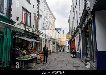 Shops in Church street in Monmouth Wales UK, Welsh town centre, narrow pedestrian street Stock Photo