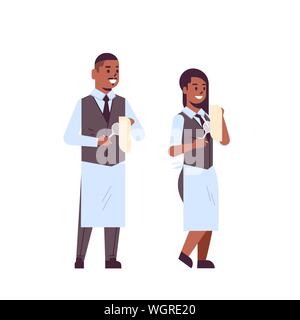 professional waiters couple polishing wine glasses with towel african american man woman restaurant workers in uniform flat full length white Stock Vector