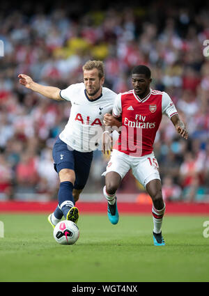 London, UK. 1st Sep, 2019. Tottenham Hotspur's Harry Kane (L) vies with Arsenal's Ainsley Maitland-Niles during the English Premier League north London Derby match between Arsenal and Tottenham Hotspur at Emirates Stadium in London, Britain on Sept. 1, 2019. Credit: Han Yan/Xinhua/Alamy Live News Stock Photo