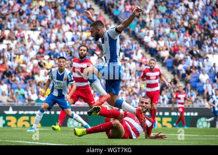 Barcelona, Spain. 1st Sep, 2019. RCD Espanyol's Matias Vargas (top) competes during a Spanish league match between RCD Espanyol and Granada in Barcelona, Spain, on Sept. 1, 2019. Credit: Joan Gosa/Xinhua Stock Photo