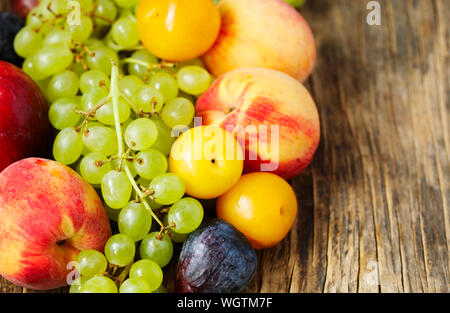 Autumn fruits on wooden background Stock Photo