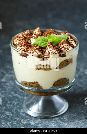 Homemade Italian dessert Tiramisu served in individual glasses Stock Photo
