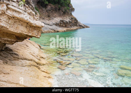 View of the rocky shore of Pulebardha beach (Seagull beach). Stock Photo