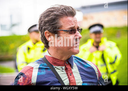 Dunfirmline, UK. 31st Aug, 2019. A Force For Good leader Alistair McConnachie seen looking apprehensive during his speech.Thousands of Scottish independence supporters marched through Dunfirmline as part of the Forward As One protest, as the coalition aims to run such event until Scotland is ‘free'. Credit: SOPA Images Limited/Alamy Live News Stock Photo