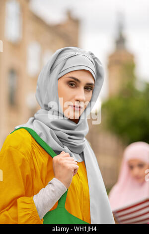 Beautiful young muslim woman standing near university Stock Photo
