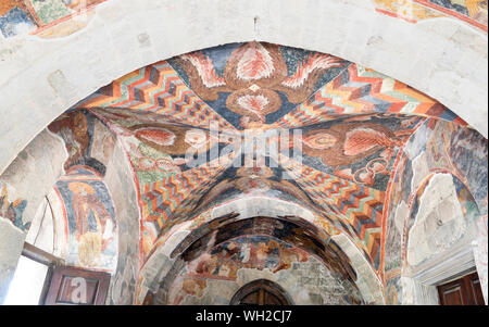 Trabzon / Turkey - August 08 2019: Frescoes in the church of Hagia Sophia. View from inside Hagia Sophia. Long exposure in darkness of inside. Stock Photo