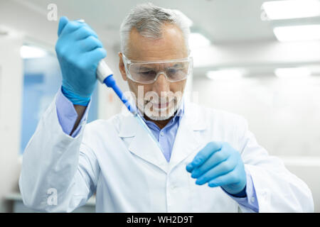 Portrait of pleased bearded man that looking at sample Stock Photo