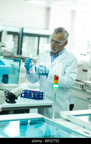 Serious scientist working in health and medicine sphere Stock Photo