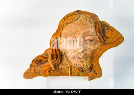 Lisbon, Portugal - July 26, 2019: A segment of a ceramic pot depicting Jesus Christ, on display at the Sao Jorge Castle Museum Stock Photo