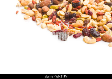 Mix of various nuts and raisins isolated on white background. Stock Photo