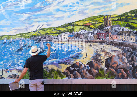 Artist David Downes working on the Sanditon mural at Bournemouth, commissioned by ITV to launch their new drama based on Jane Austen unfinished novel Stock Photo