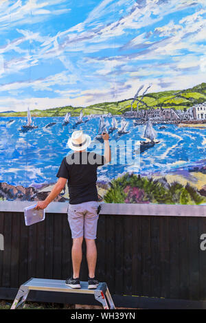 Artist David Downes working on the Sanditon mural at Bournemouth, commissioned by ITV to launch their new drama based on Jane Austen unfinished novel Stock Photo