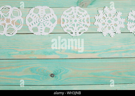 Paper snowflake and tied with twine. Stock Photo