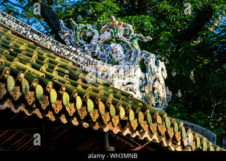Decorative pattern on the roof of Thanh Toan tile bridge. Old wooden bridge crosses the river branch dating from the 19th century. Hue, Vietnam Stock Photo