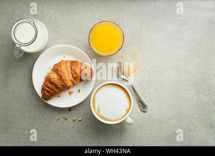 Breakfast served with croissant and coffee. Continental breakfast table Stock Photo