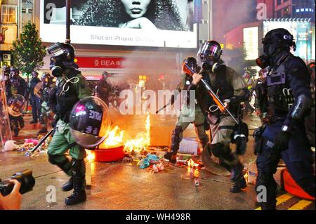 Hong Kong, China. 31st, August 2019. Riots escalates in different districts after the unauthorized peaceful rally. Protesters drop petrol bombs in front of Causeway Bay MTR station. Stock Photo