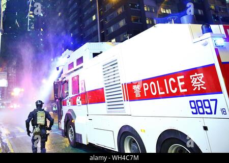 Hong Kong, China. 31st, August 2019. Riots escalates in different districts after the unauthorized peaceful rally. Here the police deploy tear gas, fire pepper balls and use water cannon to disperse the demonstration at Wan Chai. Stock Photo