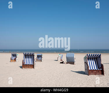 beach korbs on the island of norderney in germany on sunny day Stock Photo