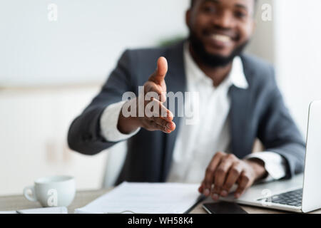 African American entrepreneur extending hand to shake Stock Photo