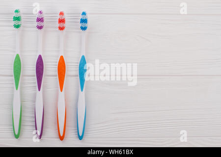 Set of tooth brushes and copy space. Stock Photo