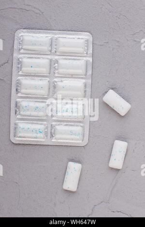 Pack of chewing gums on gray background. Stock Photo