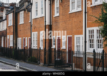 London, UK - July 18, 2019: Row of traditional English houses on a residential street in Marylebone, a chic residential area of London famous for bake Stock Photo