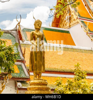 Golden statue at Wat Suthat Thepwararam, old royal Buddhist temple (wat) in Bangkok, Thailand. Stock Photo