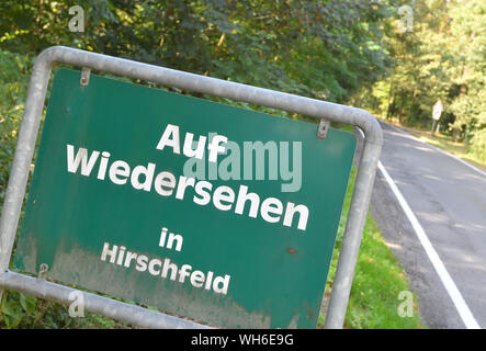 Hirschfeld, Germany. 02nd Sep, 2019. A sign with the inscription 'Auf Wiedersehen in Hirschfeld' (Goodbye in Hirschfeld) is located at the end of Hirschfeld in the Elbe-Elster district. In the small municipality of Hirschfeld in the Schradenland office, 50.6 percent of the voters gave their second vote to the AfD in the state elections. It is only a few kilometres from Hirschfeld to the border to Saxony. Credit: Patrick Pleul/dpa-Zentralbild/dpa/Alamy Live News Stock Photo