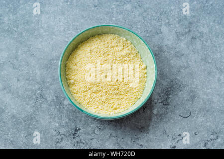 Dry Organic Corn Meal Flour in Ceramic Bowl. Ready to Use. Stock Photo