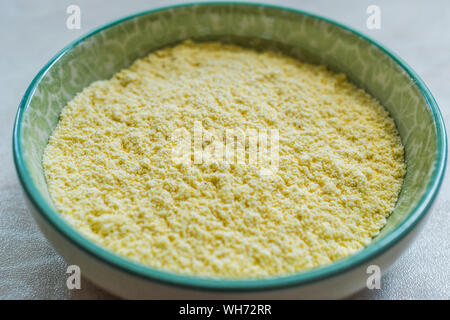 Dry Organic Corn Meal Flour in Ceramic Bowl. Ready to Use. Stock Photo