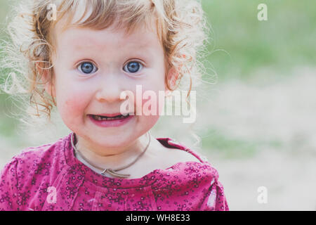 Portrait of surprised toddler girl Stock Photo