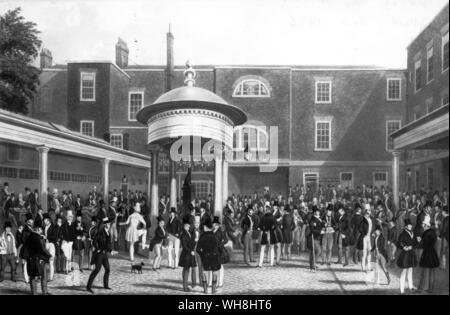 Settling Day at Tattersalls. The yard behind the Corner was the scene twice a week of auctions. A separate activity was conducted in the Subscription Room, the demure door of which is visible. This was the home of the Ring, who took over the yard each Monday to settle. Some of the leading legs have their own tables under the arcade. The plump man being paid is Crutch Robinson. 1838. The History of Horse Racing by Roger Longrigg, page 115. Stock Photo