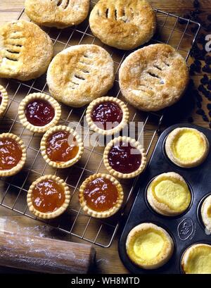 Jam tarts, maids of honour, eccles cakes and marmalade tarts. Stock Photo