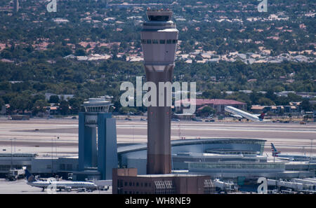 A Delta Airlines jet takes off behind the air traffic control tower at McCarran International Airport in Las Vegas, Nevada Stock Photo