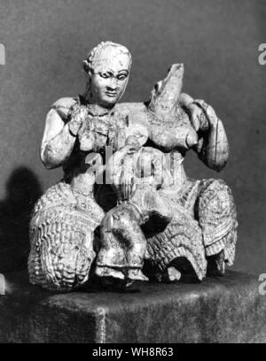 The helping hand.  Carving of the Divine Child and his attendant nurses or goddesses.  Ivory.  From Mycenae, 15th century BC Stock Photo