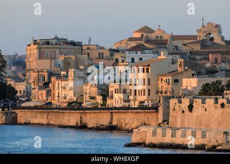 Sunset lights up Ortigia (Ortygia), from the sea, Syracuse (Siracusa), UNESCO World Heritage Site, Sicily, Italy, Mediterranean, Europe Stock Photo