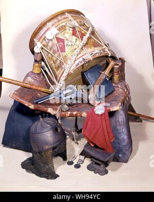 Some of Charles George Gordons belongings a drum belonging to the 11th Sudanese regiment, Gordon's camel saddle, compass, revolver, headrest and Bible, the Sultan of Darfur's helmet captured after his death in battle in 1879 medals struck by Gordon at Khartoum and those he won in Crimea Stock Photo